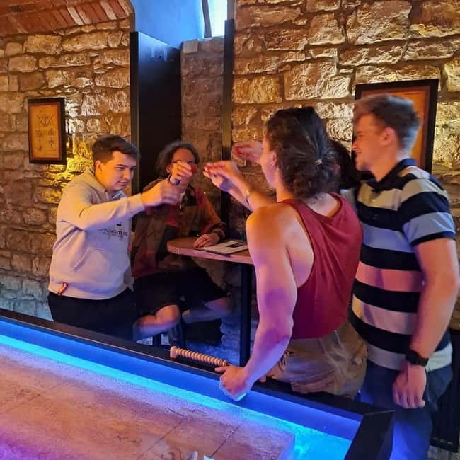Ping pong or shuffleboard for up to 6 players - A playful hour in central Prague, right where you’ll be walking anyway