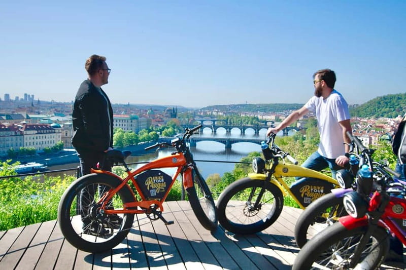 Prague: 10 Must-See Landmarks & Viewpoints on E-Bike Tour - Meeting Saská, the safety briefing, then rolling toward Charles Bridge
