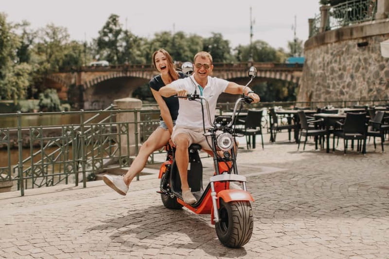 Prague: Guided Fat Tire e-Scooter Tour - A viewpoint stop that sets up the Prague Castle ride