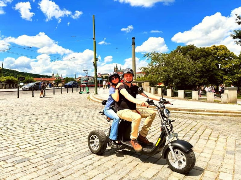 The Best ❤️ Trike Prague city tour live guided in English - John Lennon Wall, then Kampa: color, water views, and easy photo stops