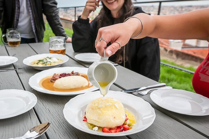 The Castle Side Food Tour: Hidden Flavors & Scenic Views - Stop 1 in Mala Strana, then that uphill tram moment